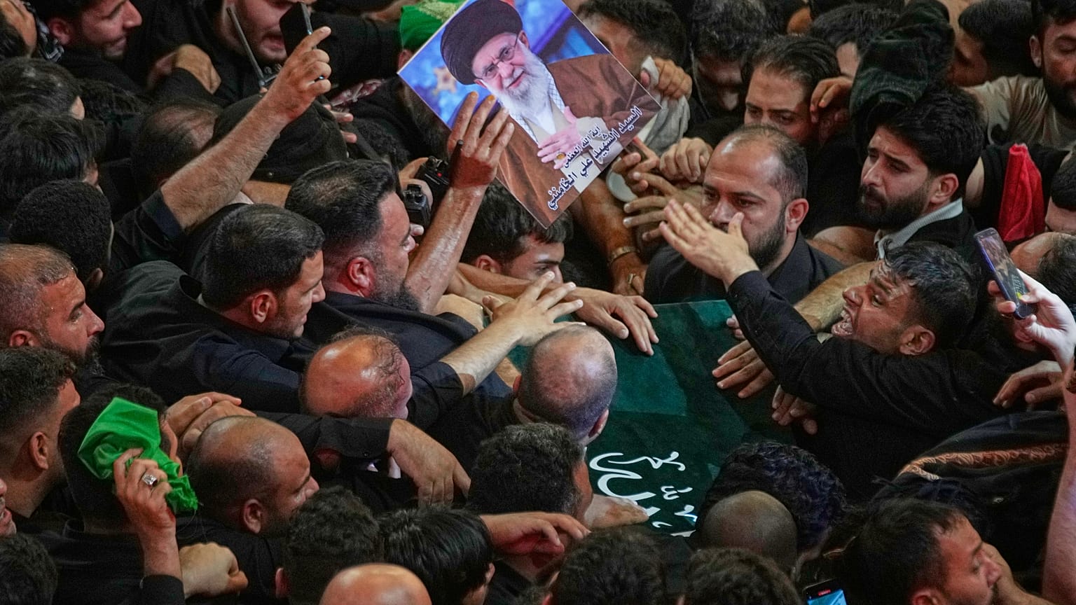 Mourners crowd around the coffin of the late Iranian Supreme Leader Ayatollah Ali Khamenei
