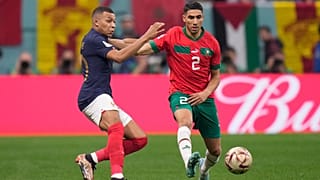 France's Kylian Mbappe challenges for the ball with Morocco's Achraf Hakimi during the World Cup semifinal between France and Morocco in Qatar, 14 Dec 2022.