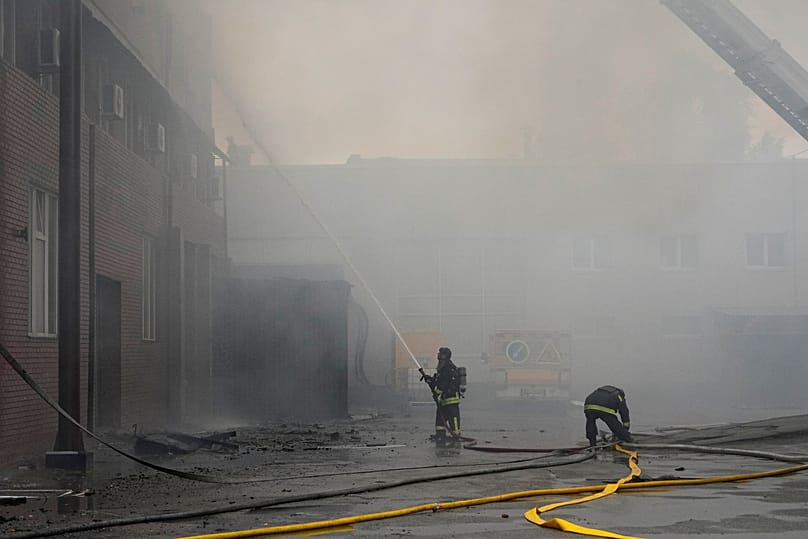 Firefighters put out a fire at a private enterprise following Russian drone attack in Kyiv, 8 July, 2026