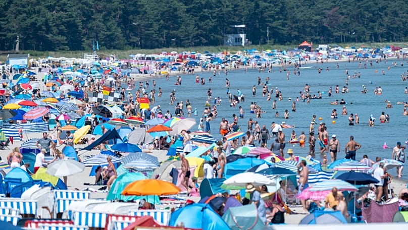 People crowd the beach at the seaside resort on the island of Rügen, 27 June, 2026