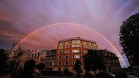 A double rainbow arches over buildings in Brussels, Sunday, June 28, 2026. 