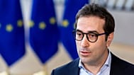Spain's Economy Minister Carlos Cuerpo Caballero speaks with the media at the European Council building in Brussels, Monday, March 9, 2026.
