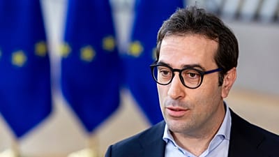 Spain's Economy Minister Carlos Cuerpo Caballero speaks with the media at the European Council building in Brussels, Monday, March 9, 2026.