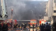 Firefighters at the scene of a footwear factory fire in Jiangtou village, 9 July, 2026