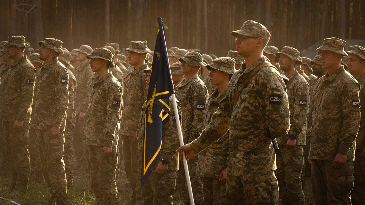 Newly recruited soldiers attend a ceremony as they celebrate the end of their training at a military base close to Kyiv, 25 September, 2023