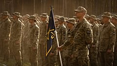 Newly recruited soldiers attend a ceremony as they celebrate the end of their training at a military base close to Kyiv, 25 September, 2023