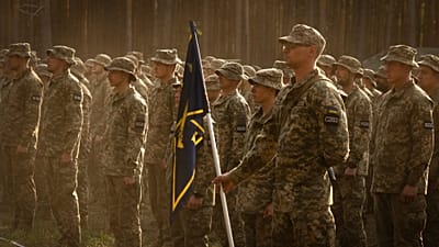 Newly recruited soldiers attend a ceremony as they celebrate the end of their training at a military base close to Kyiv, 25 September, 2023