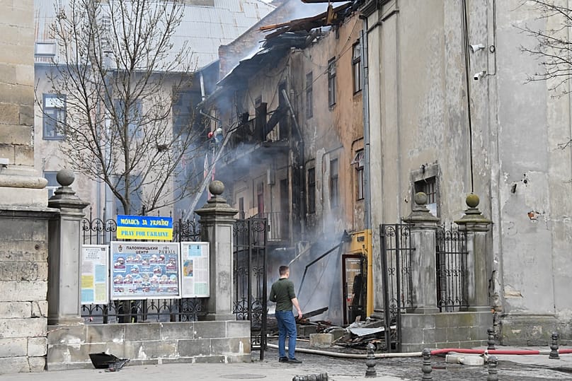 Firefighters put out a fire in the city centre following Russia's drone attack in Lviv, 24 March, 2026