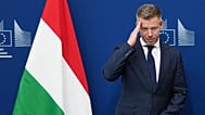 Hungary's Prime Minister Peter Magyar gestures as he is greeted by European Commission President Ursula von der Leyen prior to a meeting at EU headquarters in Brussels.