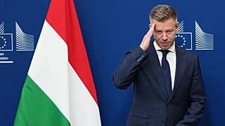 Hungary's Prime Minister Peter Magyar gestures as he is greeted by European Commission President Ursula von der Leyen prior to a meeting at EU headquarters in Brussels.