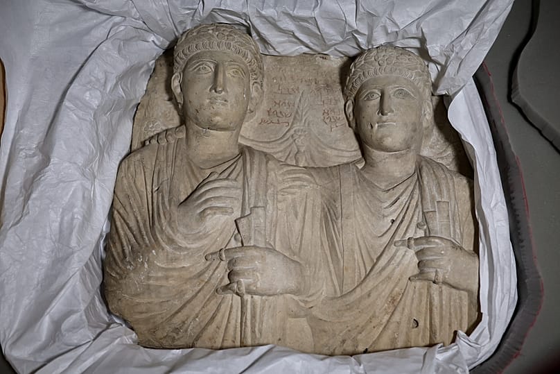 Palmyrene funerary reliefs that once adorned the walls of tombs and date to the second and third centuries A.D. are unveiled by Syrian authorities, July 8, 2026