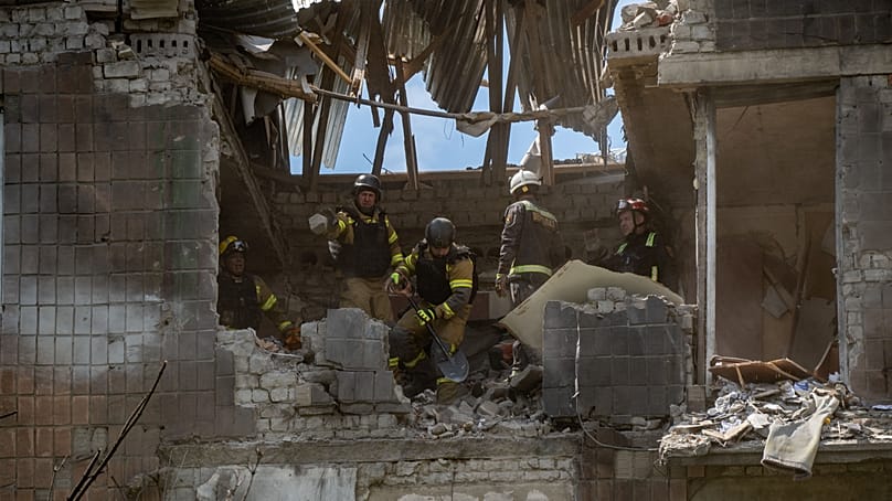 Rescue workers search for victims after a Russian air attack in Kharkiv, 8 July, 2026