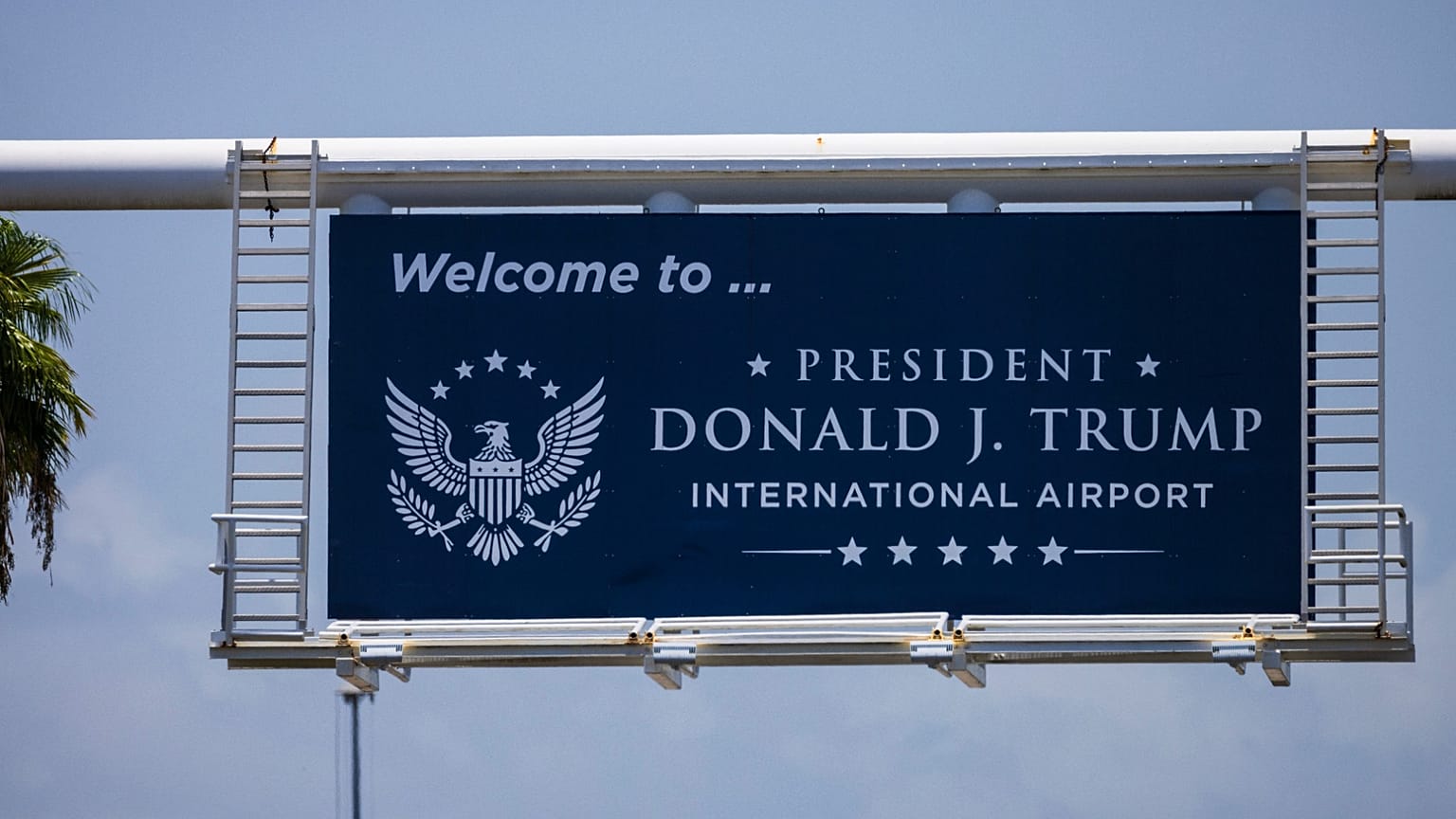 A sign displaying the name of the rebranded Donald J. Trump International Airport in West Palm Beach, 9 July, 2026