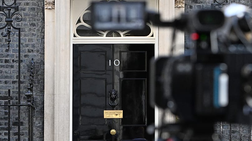 A TV camera points at the door of 10 Downing Street in London, 22 June, 2026