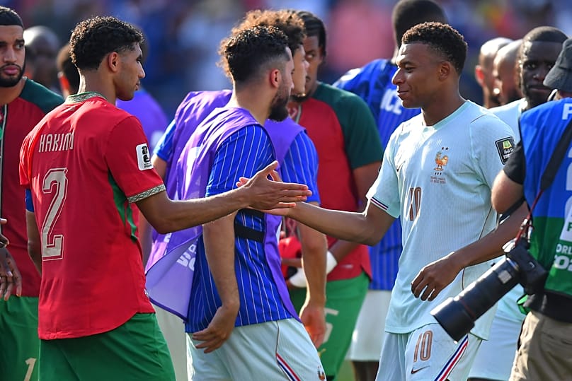 Morocco's Achraf Hakimi and France's Kylian Mbappe greet each other after the World Cup quarterfinal match in Foxborough, near Boston, Thursday, July 9, 2026.