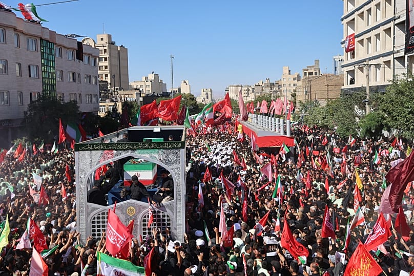 A truck carrying the coffins of the late Iranian Supreme Leader Ayatollah Ali Khamenei and members of his family during the final stage of funeral ceremonies in Mashhad.