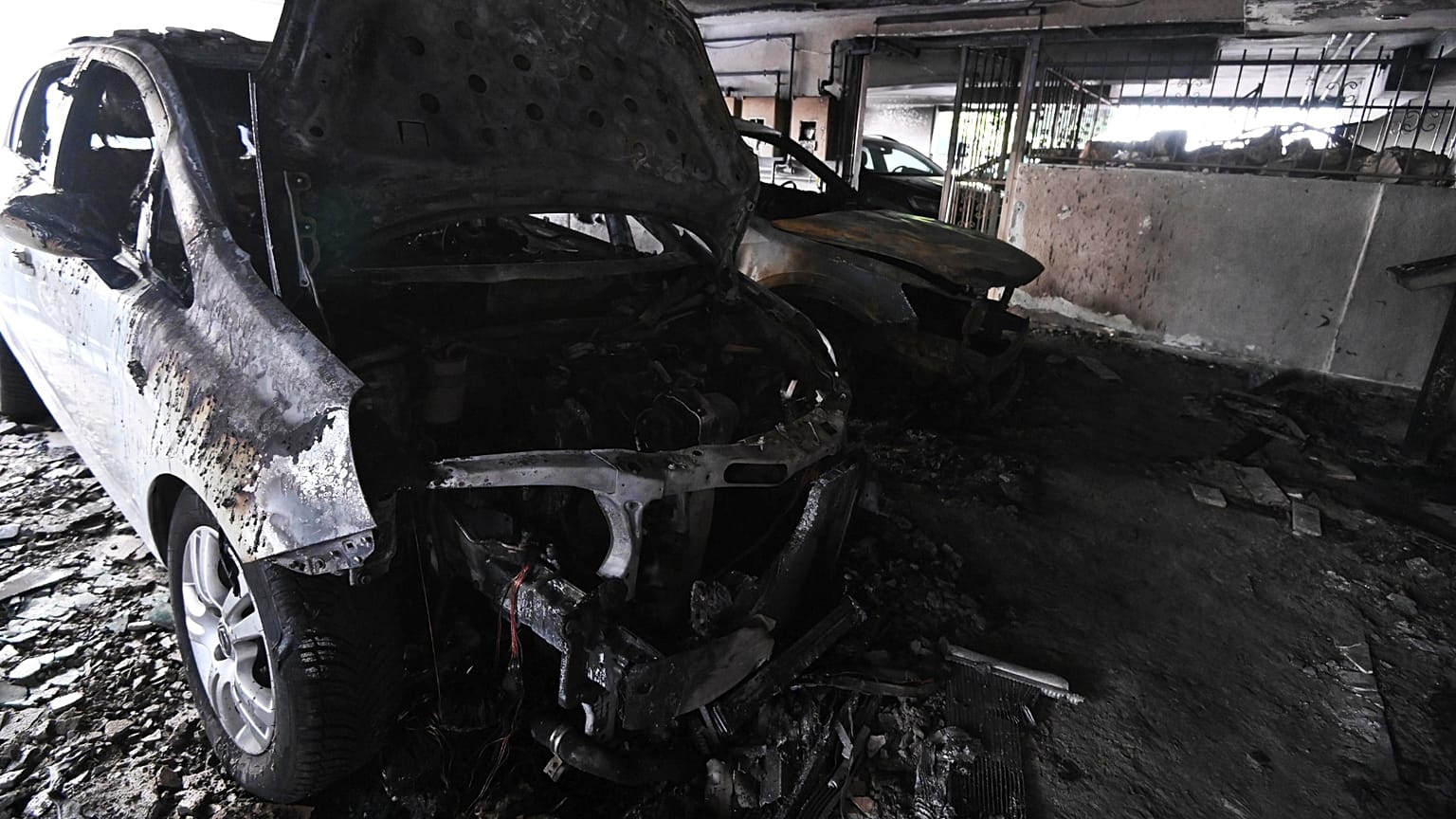 Burned vehicles following firebomb attacks that apparently targeted members of Greece's governing New Democracy party in Thessaloniki, 1 July, 2026