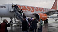 FILE. Passengers board a London-bound EasyJet flight at Amsterdam's Schiphol airport, Netherlands, Nov. 2019