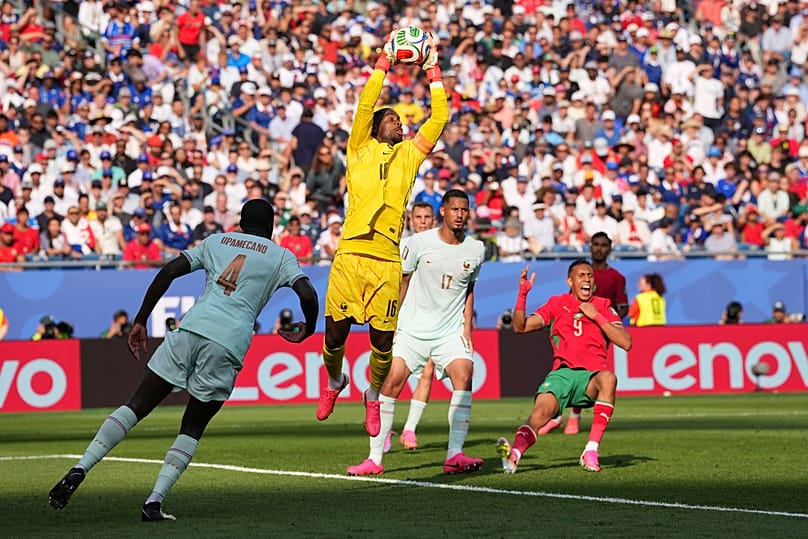 France goalkeeper Mike Maignan (16) makes a save during the World Cup quarterfinal soccer match between France and Morocco in Foxborough, Mass., near Boston, Thursday, July 9.