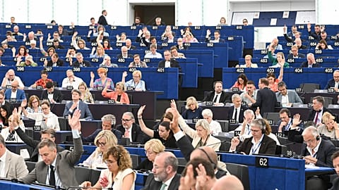Members of the European Parliament vote during a plenary session