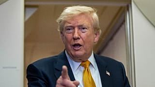 President Donald Trump speaks with reporters in flight on Air Force One after landing at U.S. Air Force Base at RAF Mildenhall, in Suffolk Eastern England, Wednesday, July 8.