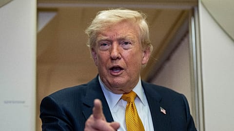 President Donald Trump speaks with reporters in flight on Air Force One after landing at U.S. Air Force Base at RAF Mildenhall, in Suffolk Eastern England, Wednesday, July 8.