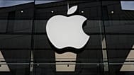 The Apple logo is illuminated at a store in Munich, April 2, 2026.