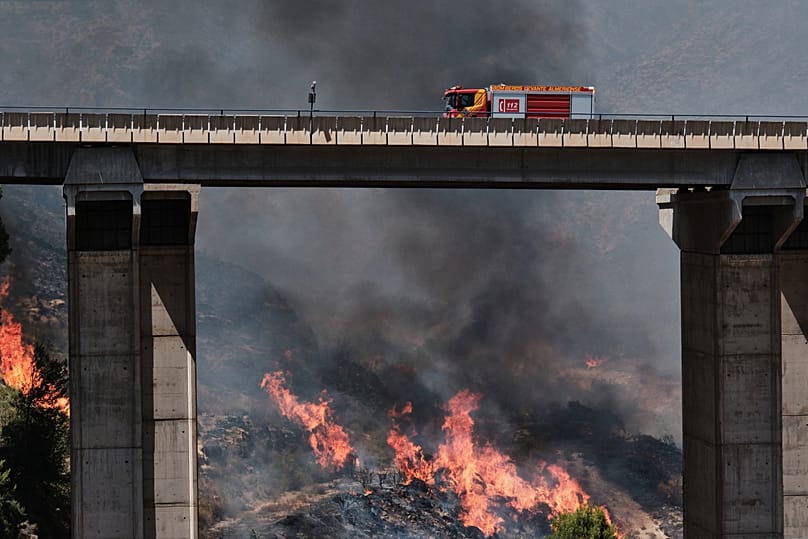 A firefighter truck next to a wildfire in Los Gallardos, near Almeria, Spain, Friday, July 10, 2026.
