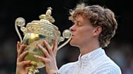Jannik Sinner of Italy kisses the winners trophy after defeating Alexander Zverev of Germany in the men's singles final at Wimbledon Tennis Championships, July 12, 2026.