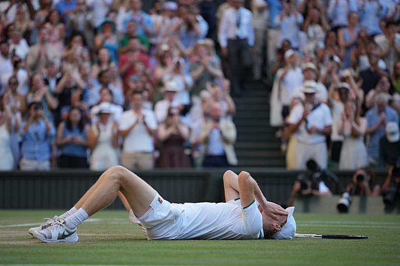 Jannik Sinner of Italy reacts after defeating Alexander Zverev of Germany in the men's singles final at Wimbledon Tennis Championships in London, Sunday, July 12, 2026. 
