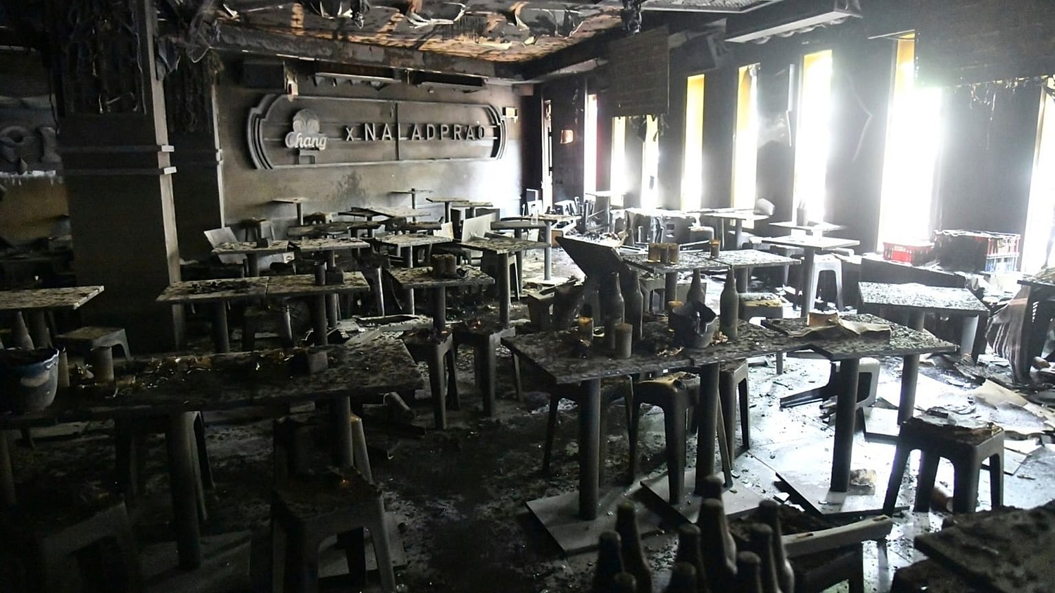 The interior of a beer bar is seen after a fire in Bangkok, 13 July, 2026