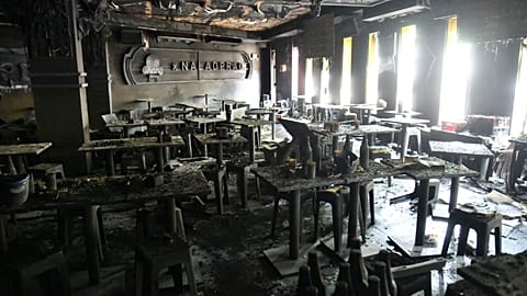 The interior of a beer bar is seen after a fire in Bangkok, 13 July, 2026
