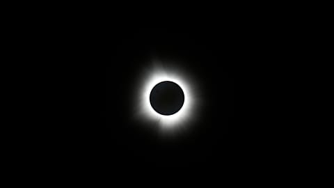 The moon covers the sun during a total solar eclipse on Monday 8 April 2024, as seen from Carbondale, Illinois.