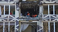 Medical workers remove the debris in a damaged private clinic after a Russian drone hit a hospital room killing a patient in Kyiv, 5 January, 2026