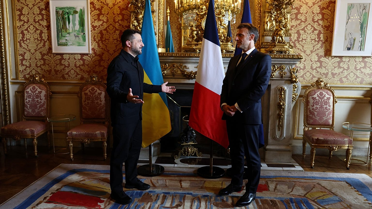 French President Emmanuel Macron, right, talks with Ukrainian President Volodymyr Zelenskyy during a meeting in Paris, France, Monday, July 13, 2026.