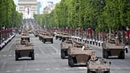 Des chars et des véhicules blindés défilent sur les Champs-Élysées lors du défilé du 14 juillet, lundi 14 juillet 2025 à Paris.