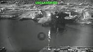 A still image from video shows an explosion at Iran's Bandar Abbas Naval Base after what the US says was a strike by three Corsair unmanned surface vessels on 12 July 2026.