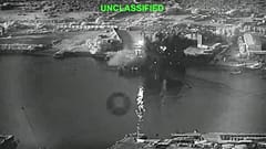 A still image from video shows an explosion at Iran's Bandar Abbas Naval Base after what the US says was a strike by three Corsair unmanned surface vessels on 12 July 2026.