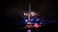 Fireworks and drones illuminate the Eiffel Tower in Paris during the eve of Bastille Day celebrations, 13 July, 2026