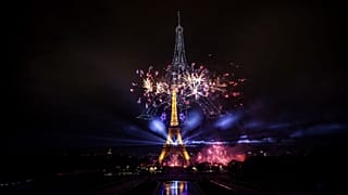 Fireworks and drones illuminate the Eiffel Tower in Paris during the eve of Bastille Day celebrations, 13 July, 2026