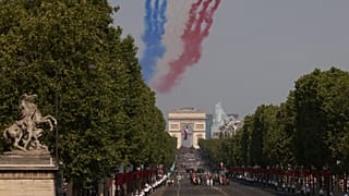 Jets from the acrobatic Patrouille de France fly during the Bastille Day military parade in Paris, 14 July, 2026