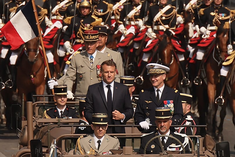 French President Emmanuel Macron arrives at the Bastille Day military parade in Paris, 14 July, 2026