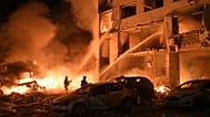 Emergency services personnel work to extinguish a fire following Russian missile attacks in Kyiv, 6 July, 2026