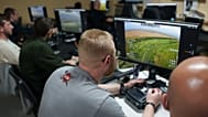 A serviceman with Ukraine’s K-2 brigade flies a midrange drone toward Russian positions on the front line, from a command center in Ukraine on June 20, 2026. 