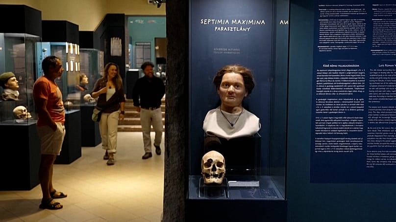 A facial reconstruction of a Roman-era resident of Aquincum is displayed alongside the original skull that inspired it at the Aquincum Museum in Budapest
