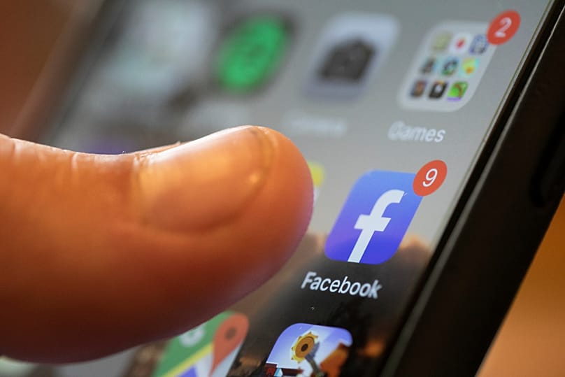 An iPhone displays the Facebook app in New Orleans, 11 August, 2019
