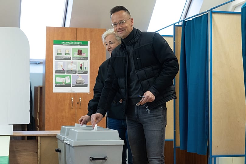Hungarian Foreign Minister Peter Szijjarto and his wife cast their votes during the general election in Dunakeszi, Hungary, Sunday, April 12, 2026