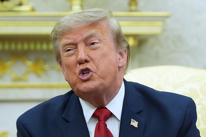 US President Donald Trump speaks in the Oval Office of the White House, 14 July, 2026