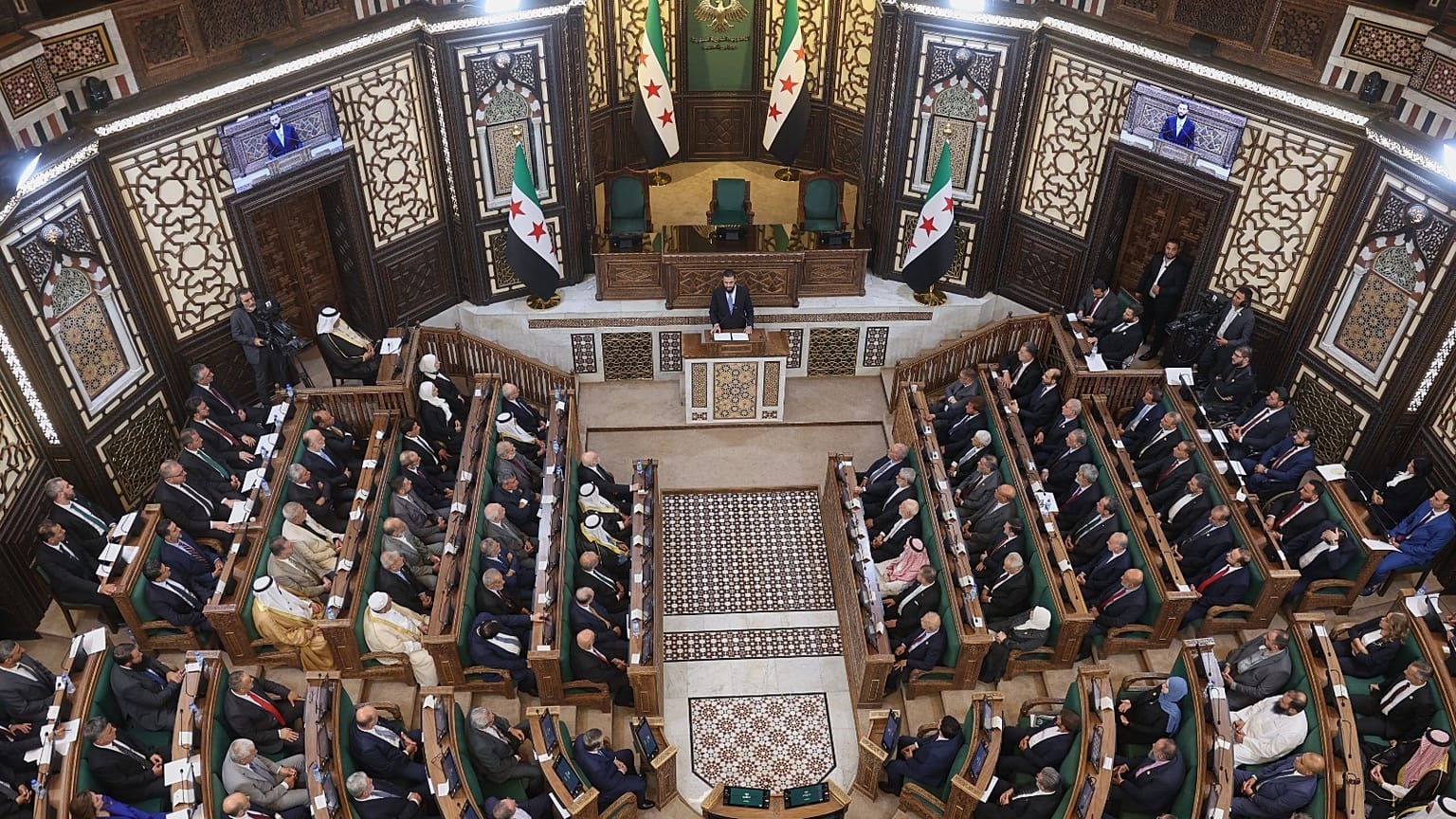الرئيس السوري الانتقالي أحمد الشرع يلقي كلمة أمام الجلسة الافتتاحية لمجلس الشعب السوري المشكل حديثا، وهي الأولى منذ سقوط حكومة الرئيس بشار الأسد،  سوريا، الأحد 12 يوليو 2026. 