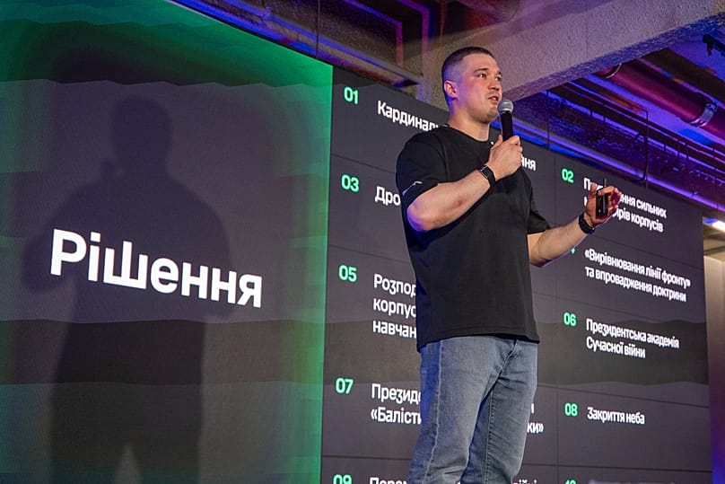 Outgoing Ukraine's Defense Minister Mykhailo Fedorov speaks during a briefing to journalists in Kyiv, Ukraine, Thursday, July 16, 2026. The sign on left reads "Decisions"